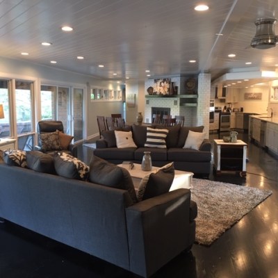 a living room filled with furniture and a large window