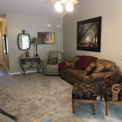 a living room filled with furniture and a fireplace