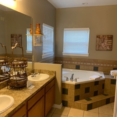 a kitchen with a sink and a mirror