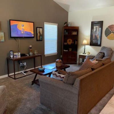 a living room filled with furniture and a fire place