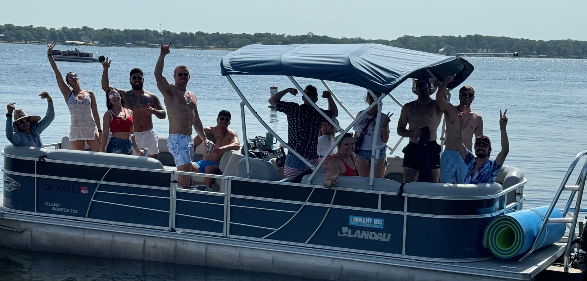 a group of people in a boat on a body of water